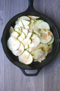 sliced apples with cornstarch mixture for skillet spiced apple crumble.