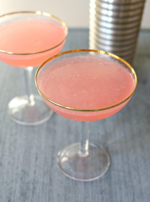 This pretty pink Blushing Grapefruit Cocktail is tangy and refreshing. A fun cocktail to say "cheers" with your gal pals.